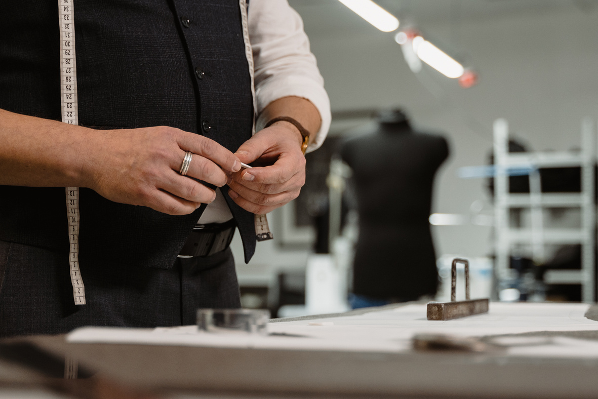 Tailor Holding a Tailor's Chalk