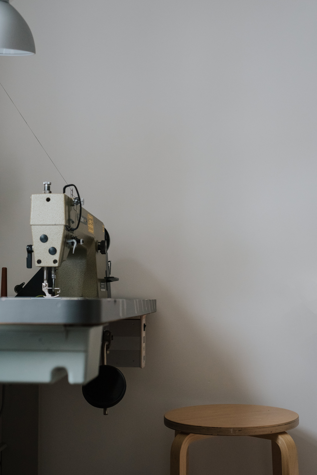 Sewing machine in light workshop